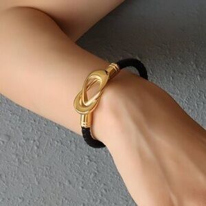 Elegant Gold and Black Bracelet
